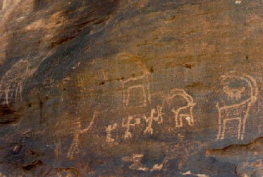 Day trip. Pre-Islamic (pre-600s) drawings on rocks near a Bedouin camp. [September 1992]